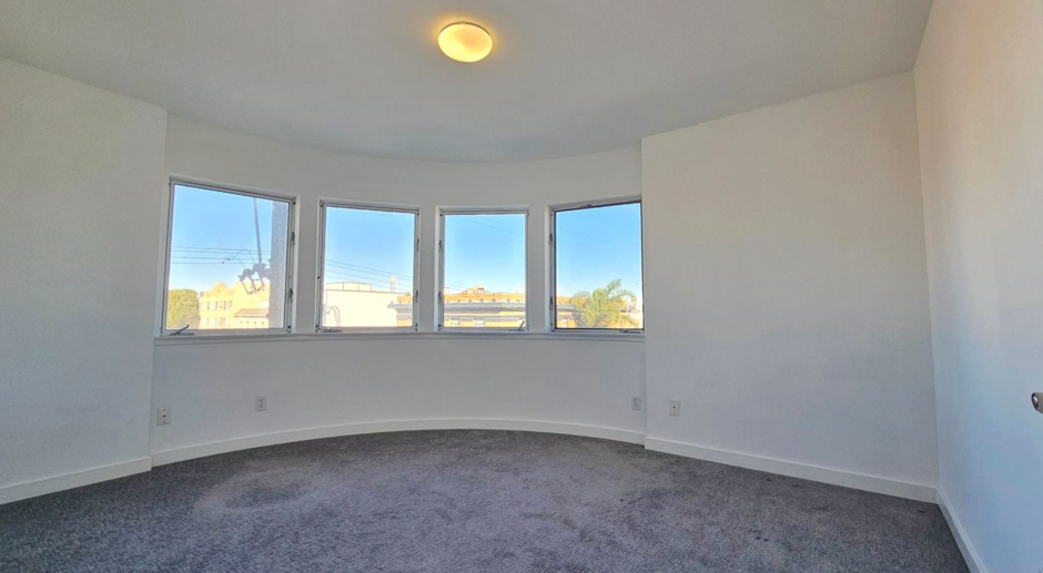 Mission: Bright 4 Bed 2 Bath Condo w/ Private Deck, Garage Parking, and Shared Rooftop Deck 