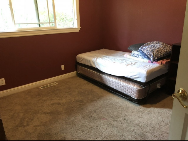 Bedroom for rent in a shared family home 