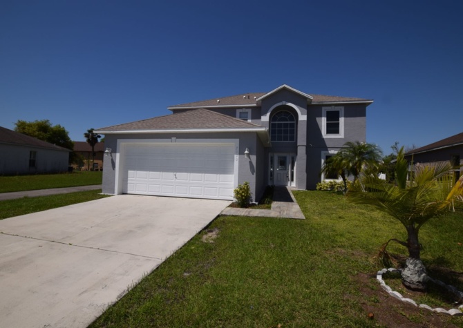 Houses Near 4 Bedroom, 2.5 Bath House with 2-car Garage For Rent at 2120 Marisol Loop, Kissimmee, FL 34743