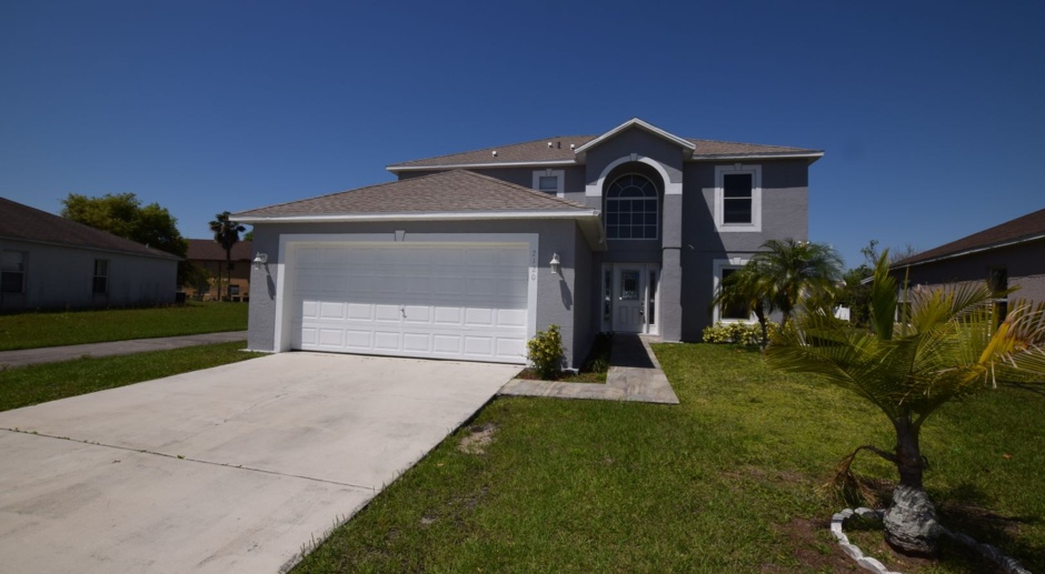 4 Bedroom, 2.5 Bath House with 2-car Garage For Rent at 2120 Marisol Loop, Kissimmee, FL 34743